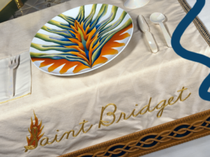 St Brigid (dinner table) place setting in Judy Chicgo's artwork The Dinner Party.