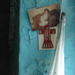 A photo is pinned behind a wall clip