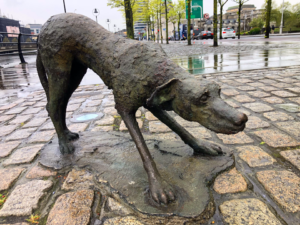 Bronze sculpture by Rowan Gillespie of a dog, forming part of the Dublin Iris Famine Memorial.