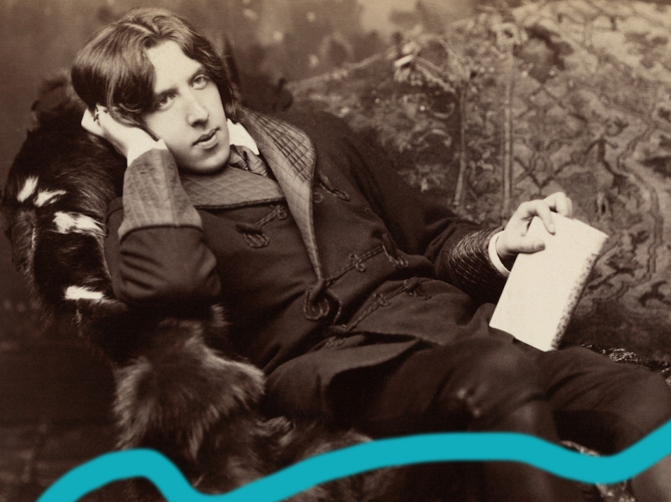 An Oscar Wilde portrait, of him reclining on a fur, holding a book.